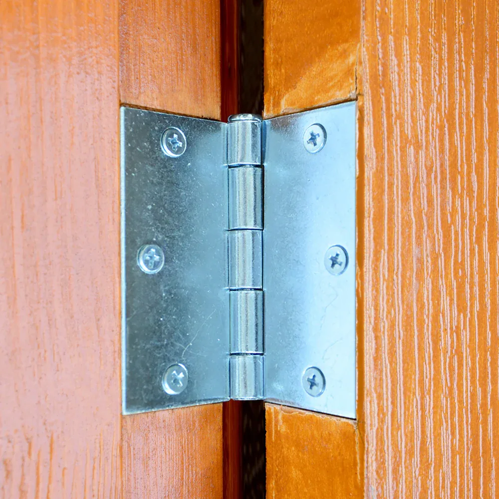 Silver steel butt hinge mounted on a wood door